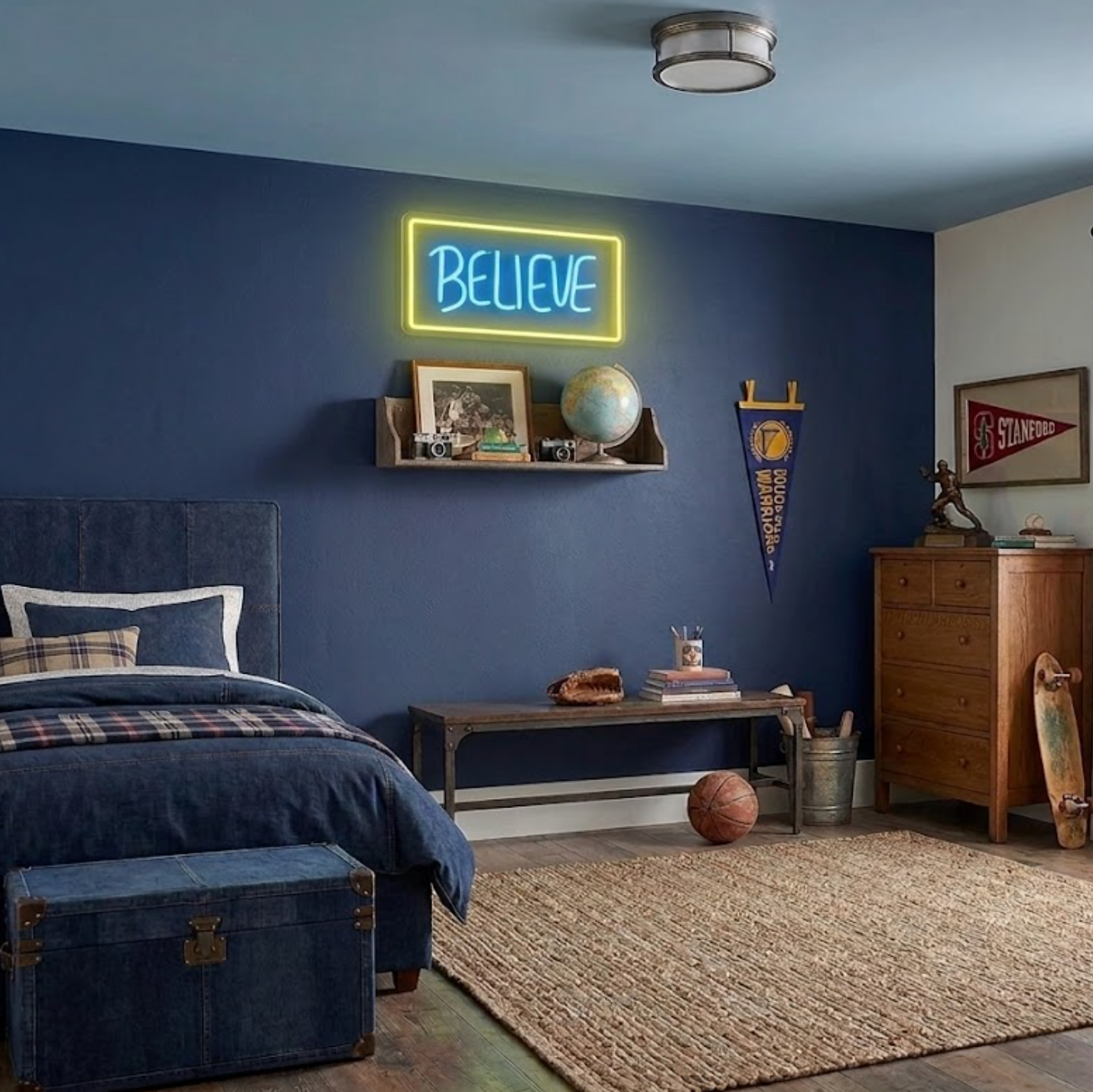 Neon 'BELIEVE' sign on a blue wall in a bedroom with furniture and decor.