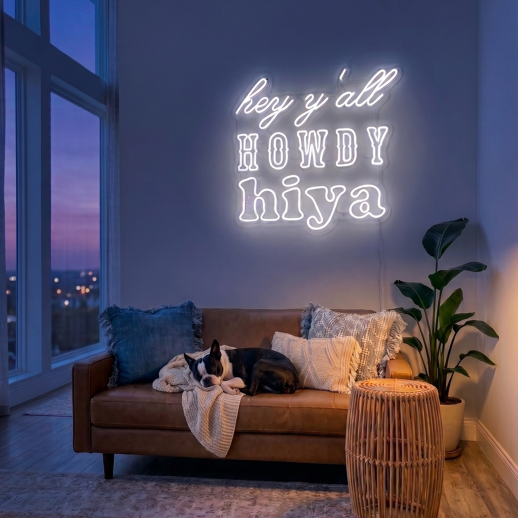 Neon sign with 'hey y'all howdy hiya' in a living room with a couch, dog, and plant.