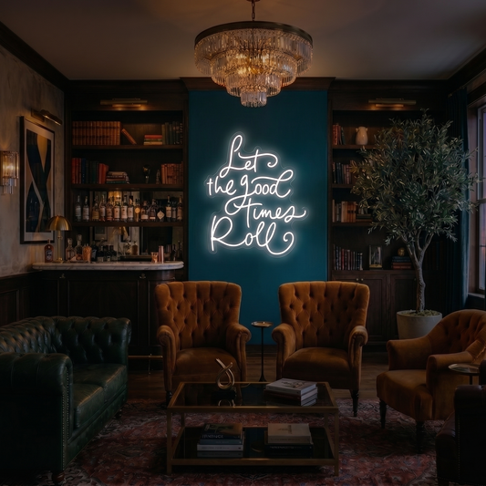 Neon sign reading 'Let the Good Times Roll' in a cozy lounge setting with furniture and decor.